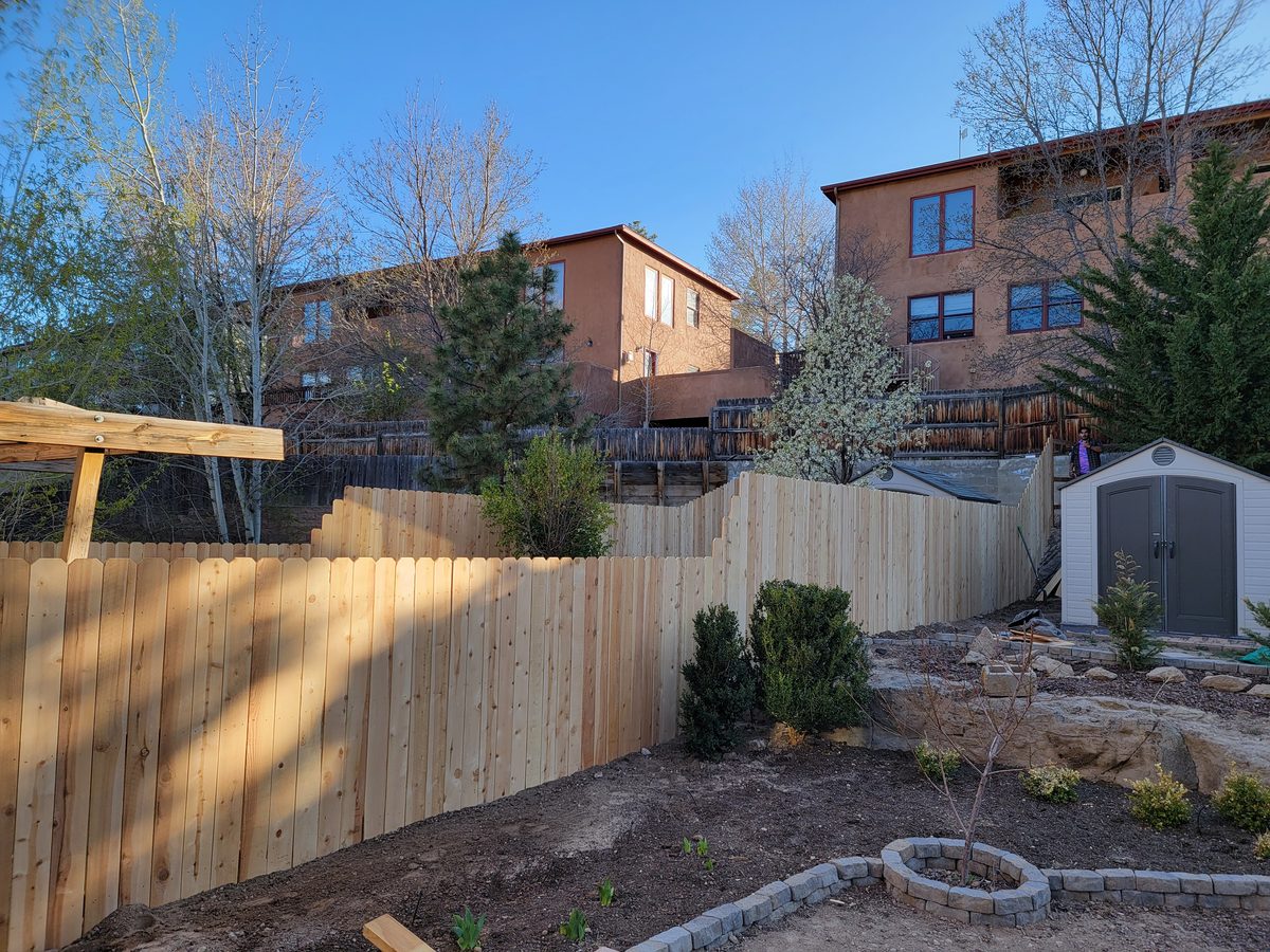 Stepped cedar fence on NM slope